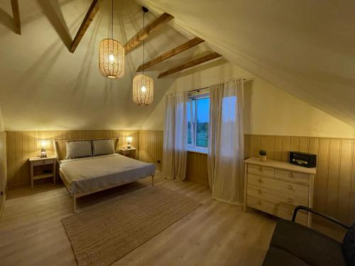 Кровать или кровати в номере Family holiday house near to Baltic sea in Pitrags "JAUNZUMBRI"