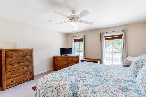 a bedroom with a bed and a ceiling fan at Heavenly Hideaway in Ludlow