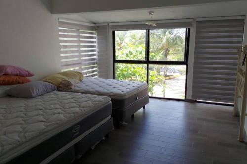 Ένα ή περισσότερα κρεβάτια σε δωμάτιο στο Casa c/embarcadero en Boca del Río Gran Ubicación