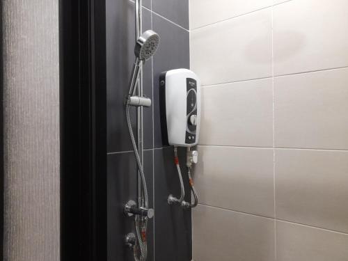 a shower in a bathroom with a phone on a wall at Pacific Towers Star Seksyen 13 PJ Jaya One Parking Pool Kitchen in Petaling Jaya