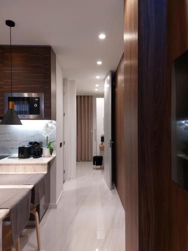 a kitchen with a table and a dining room at Liris Holiday Apartments in Nazaré