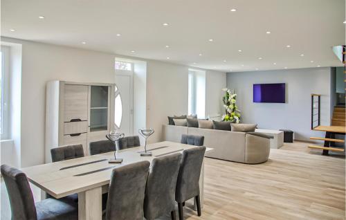 a dining room and living room with a table and chairs at Gorgeous Home In Ussel With Wifi in Ussel