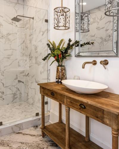 a bathroom with a sink and a shower at The Peninsula in Cape May Court House