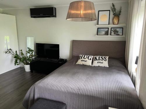a bedroom with a bed with two pillows on it at 4 person holiday home in VÄRMDÖ-By Traum in Värmdö