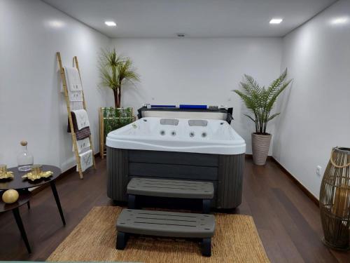 a hot tub in the middle of a living room at Luxury Vila with Spa and Pool in Vila do Conde
