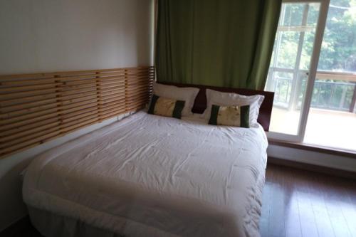 Postel nebo postele na pokoji v ubytování Moon-hyo House 1
