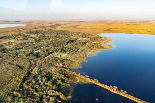 an island in the middle of a body of water at Estancia Iberá in Colonia Carlos Pellegrini
