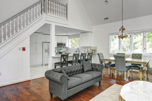 a living room with a couch and a table at The Peninsula in Cape May Court House