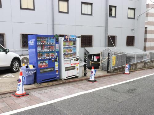 a couple of vending machines on the side of a street at Tokyo Inn in Tokyo
