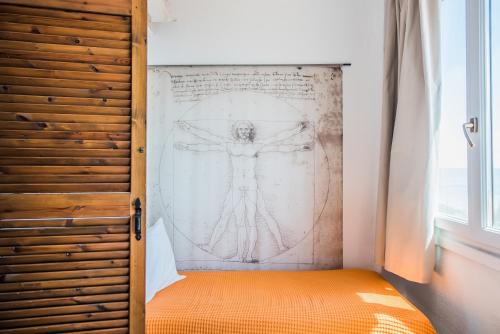 a room with a drawing on the wall at Mola Home by halu! Villas in Mola Kalyva