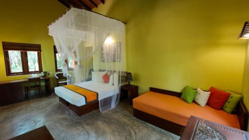 a bedroom with two beds in a room with yellow walls at Kuwera Eco Lodge in Sigiriya