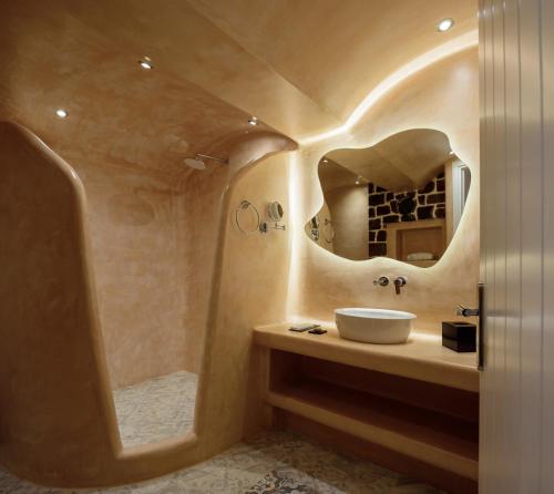 a bathroom with a sink and a shower at Acro Blue Luxury Villas in Akrotiri