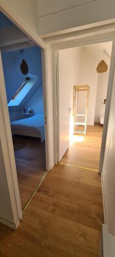an empty room with a room with a ladder in it at Gîte chez Julie et Franck in Cappy
