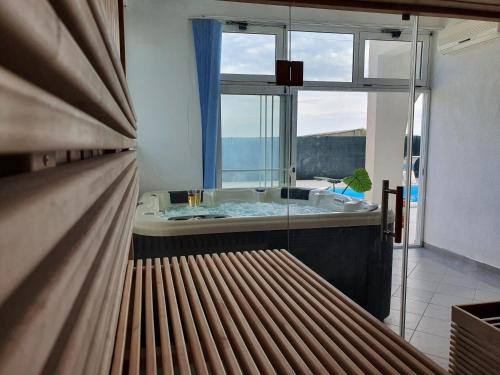 a bathroom with a tub and a large window at Villa Anja Lux, Split in Split