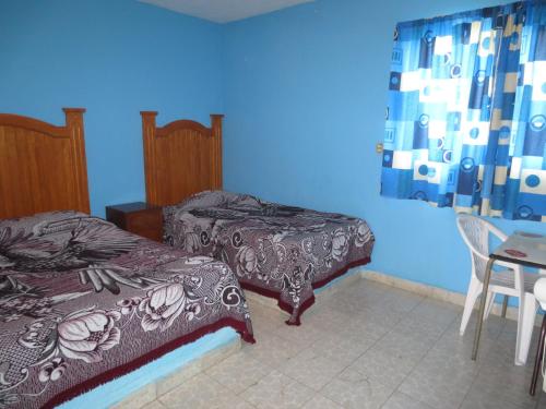 Postel nebo postele na pokoji v ubytování Hotel Rocio