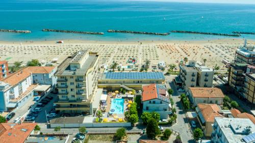 an aerial view of a beach and buildings at Hotel Milanese in Rimini