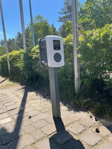 a mail box sitting on the side of a sidewalk at Aquamaris Strandresidenz Rügen in Juliusruh