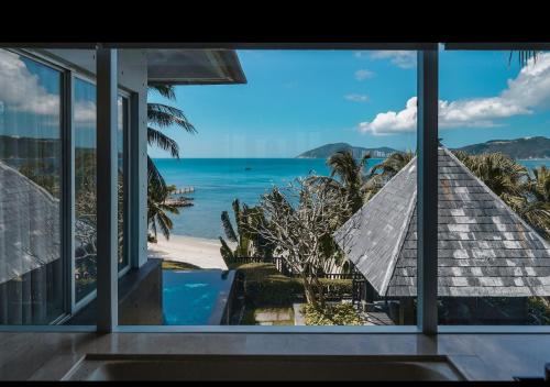 a view of the ocean from a house at Mandarin Oriental, Sanya in Sanya