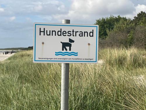 a sign for a huderkart on a beach at Aquamaris Strandresidenz Rügen in Juliusruh