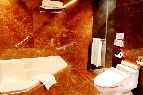 a bathroom with a toilet and a sink and a shower at Hù House - Taipei in Taipei