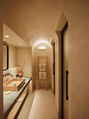 a bathroom with a sink and a sink at NOS Hotel & Villas in Sifnos