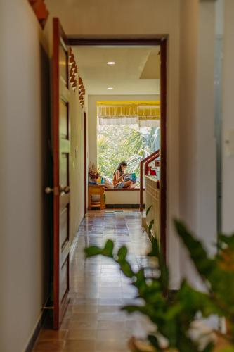 a hallway with a person laying in a bed in a room at Homestay in Tay Ninh in Tây Ninh