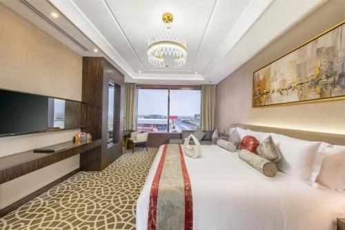 Postel nebo postele na pokoji v ubytování Nivel Hotel Abha