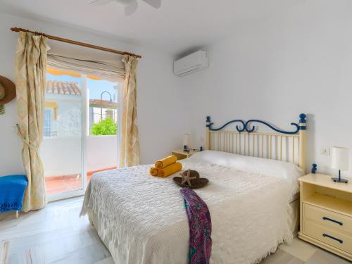 31 Mijas Playa Club townhouse La Cala tesisinde bir odada yatak veya yataklar