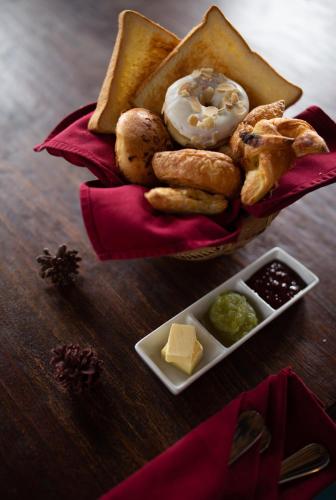a basket of pastries and other foods on a table at Plataran Bromo in Bromo