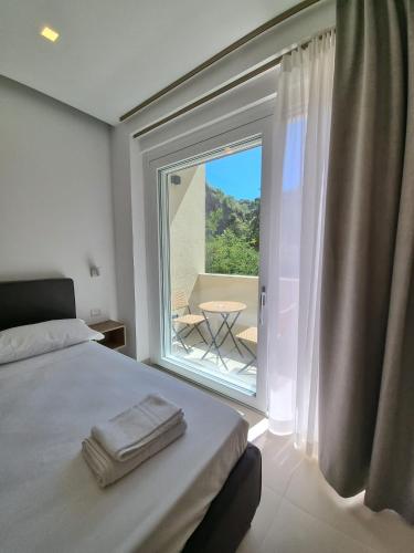 Katil atau katil-katil dalam bilik di Marea Retreat Rooms