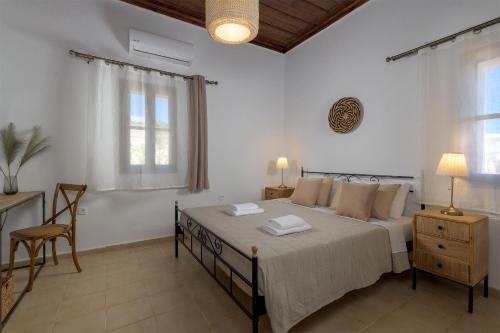 Säng eller sängar i ett rum på Villa Dorinna