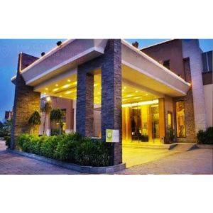 a large building with lights on in front of it at Tivoli Garden Resort in New Delhi