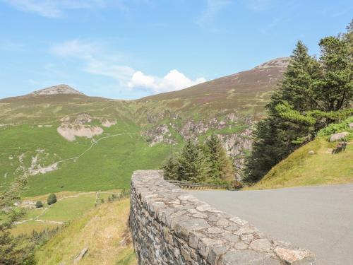 a stone wall on the side of a mountain at Cwm Ceiliog Annex in Caernarfon