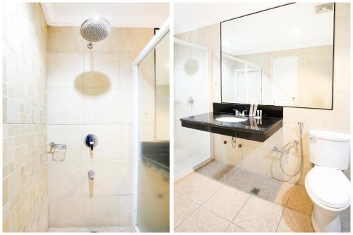 a bathroom with a toilet and a sink at Hotel Euroasia By BLUEBOOKERS in Angeles