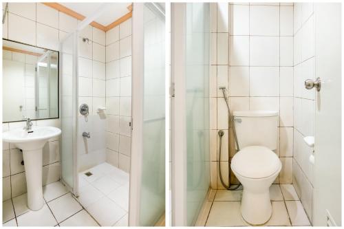 a bathroom with a toilet and a shower and a sink at Hotel Euroasia By BLUEBOOKERS in Angeles
