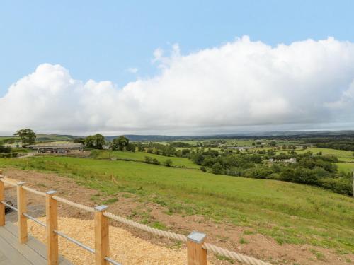a view of a field from the deck of a house at Laird Lodge 3 in Lockerbie