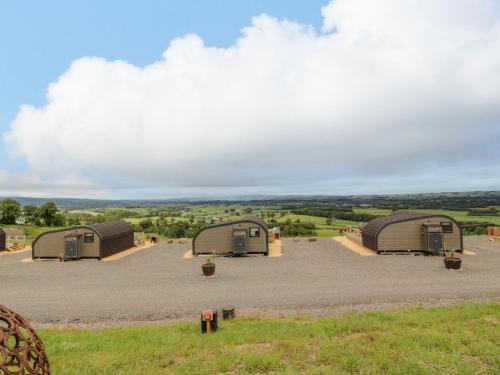 a group of three domes on a gravel field at Laird Lodge 3 in Lockerbie
