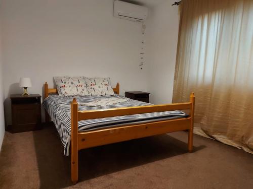 En eller flere senge i et værelse på Vila ALBA AREAL