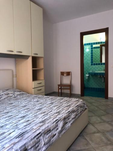 Posteľ alebo postele v izbe v ubytovaní Appartamento ad un passo dalla spiaggia