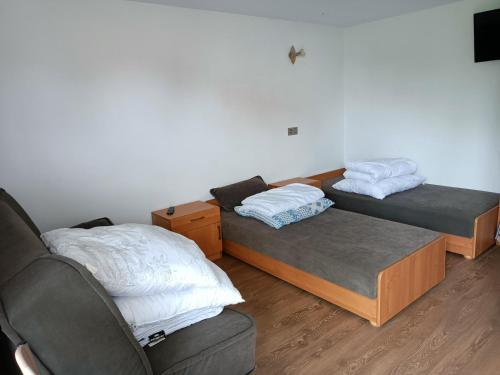 Una cama o camas en una habitación de Pokoje Gościnne "Keja"
