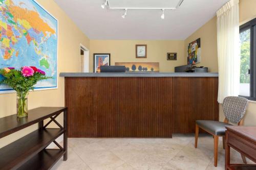 a waiting room with a reception desk and a counter at Travelodge by Wyndham Presidio San Francisco in San Francisco