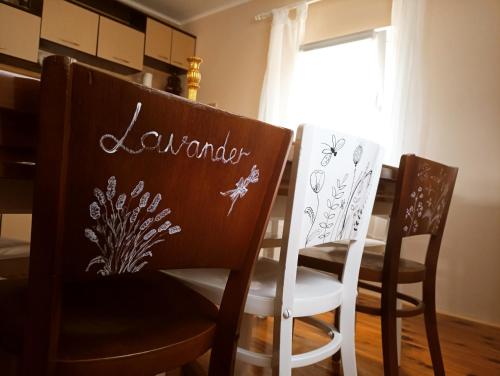 a dining room with two chairs and a table at Kuca za odmor ViP in Kremna