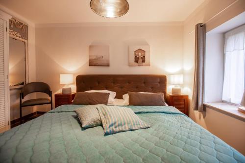 a bedroom with a large bed with two pillows on it at Sonnenwieck 01 in Wieck