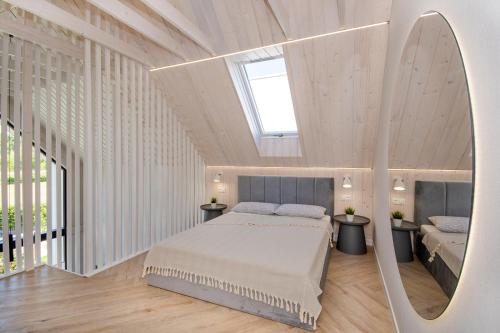 Tempat tidur dalam kamar di Baltico Stodoła