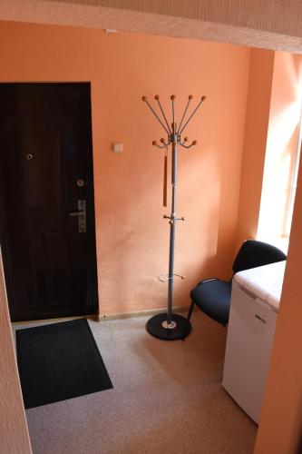 a room with a pole in front of a door at Ukstiņa ielas apartamenti in Liepāja