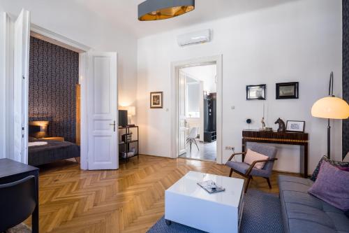 a living room with a couch and a table at Double Blue Apartment in Budapest Downtown in Budapest