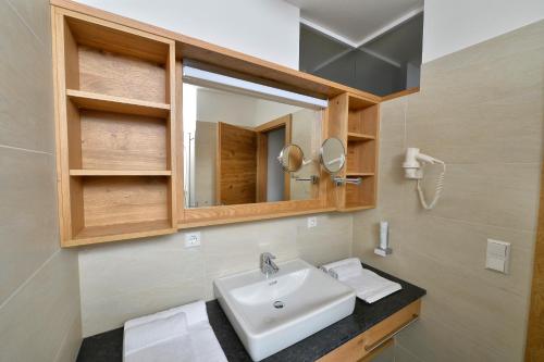 Koupelna v ubytování Almhotel Kärnten