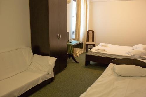 Кровать или кровати в номере Curtea Brancovenească