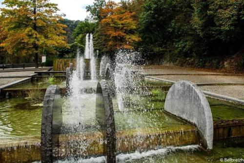 a fountain in the middle of a park at Lî Stôle in Durbuy