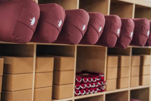 a row of baseball caps on a shelf with boxes at Beim Oswald in Bad Kleinkirchheim